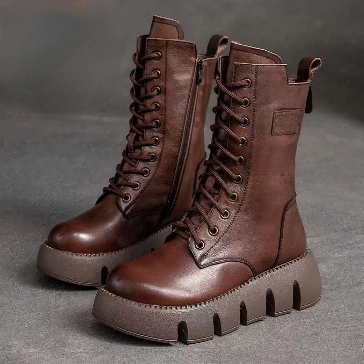 Women's black vegan leather ankle platform boots with sleek silhouette and comfortable chunky sole