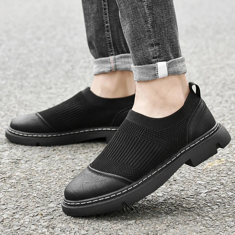 Black leather mesh slip-on sneakers with stretch-knit upper and genuine leather reinforcements for urban commuters
