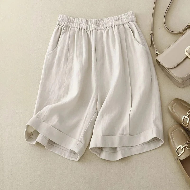 Women's beige linen shorts relaxed fit elastic waistband rolled cuffs side pockets lightweight casual