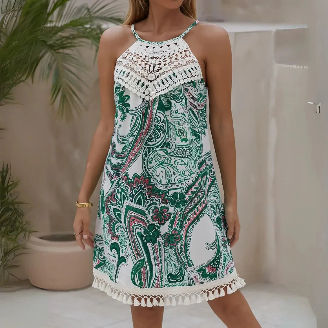 Boho maxi dress with crochet halter neckline, paisley print, tassel-trimmed hem, sleeveless beachwear