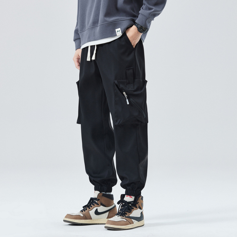 Men's olive tapered cargo joggers with zippered utility pockets for active everyday wear
