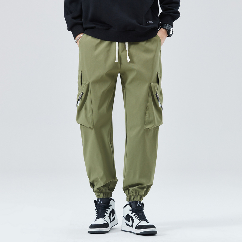 Men's tapered cargo joggers with zippered pockets, streamlined utilitarian silhouette for active wear
