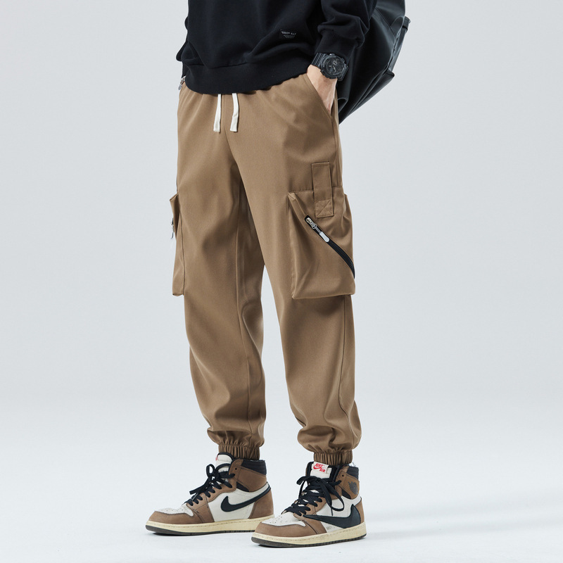 Men's tapered cargo joggers with zippered side pockets, streamlined utilitarian silhouette for active wear