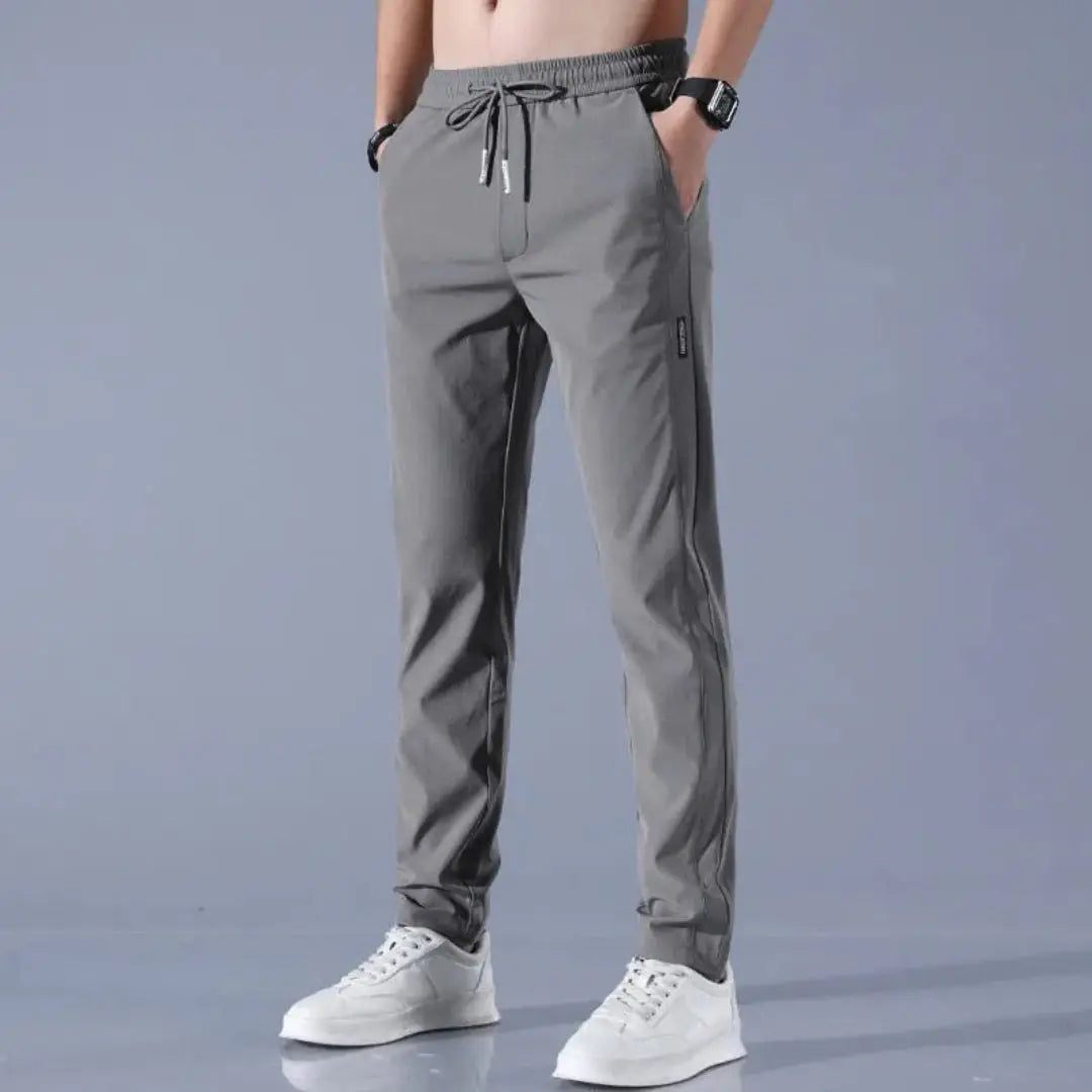 Men's slim fit gray StretchTech jogger pants lightweight quick-dry drawstring athleisure tapered silhouette