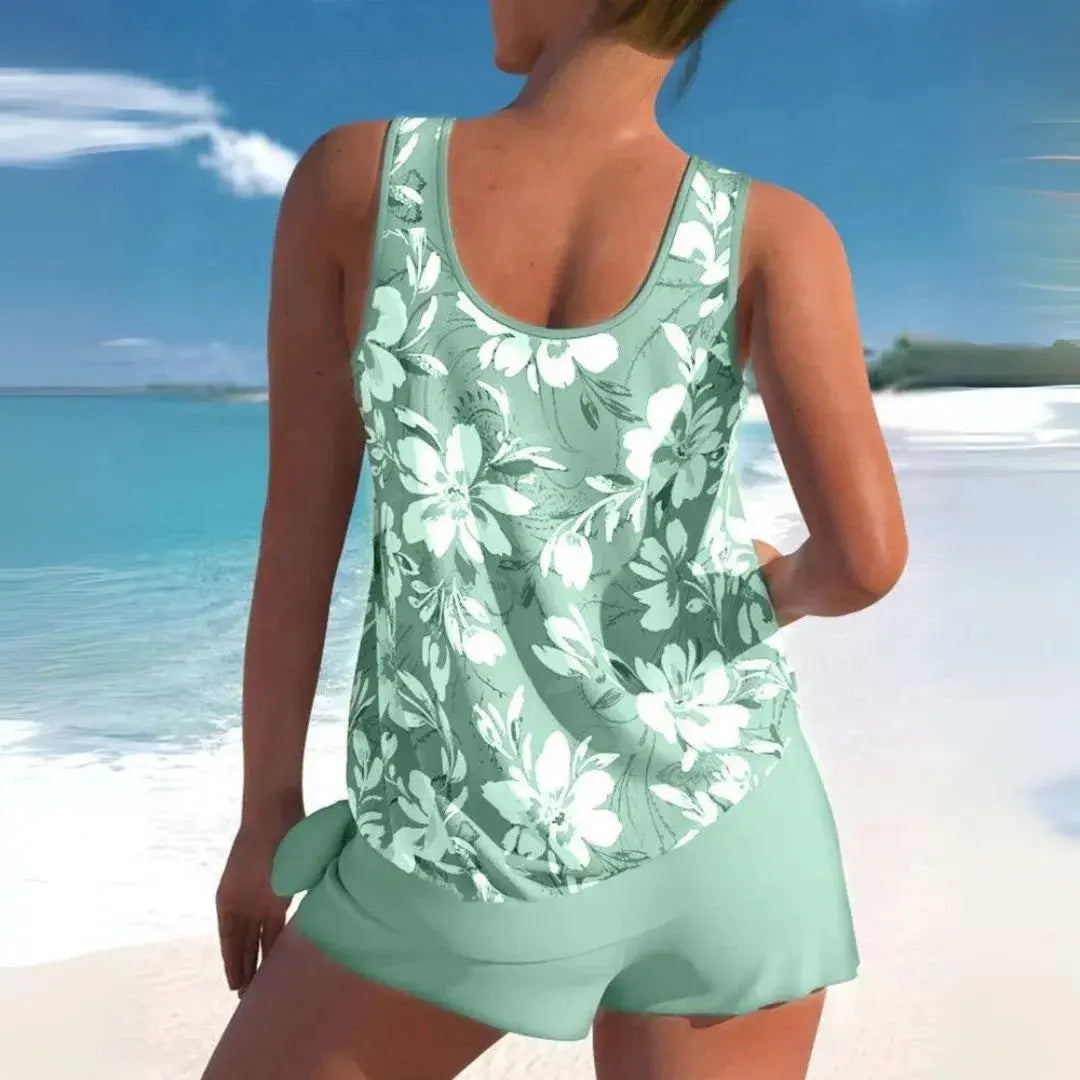 Women's floral tankini shorts swim set with adjustable straps, sleeveless top and solid bottoms