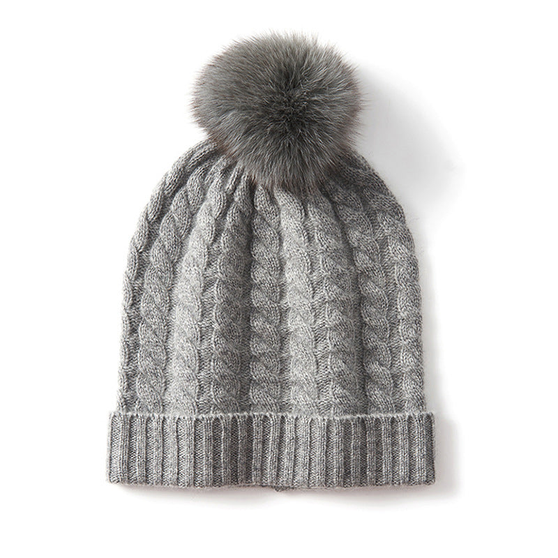 Charcoal cable-knit cashmere blend unisex beanie with oversized pom-pom for cold weather warmth