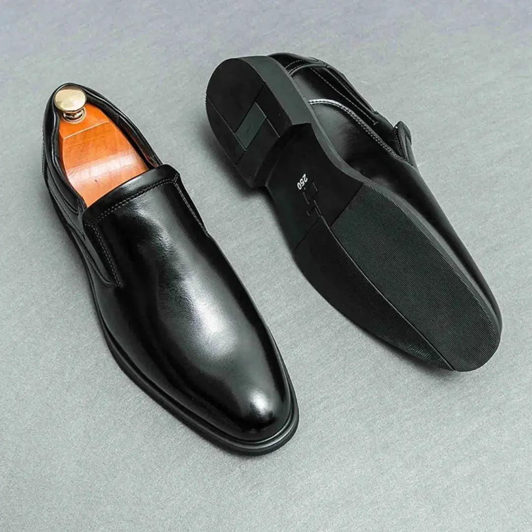 Men's black slip-on loafers streamlined silhouette smooth finish leather lining rubber sole