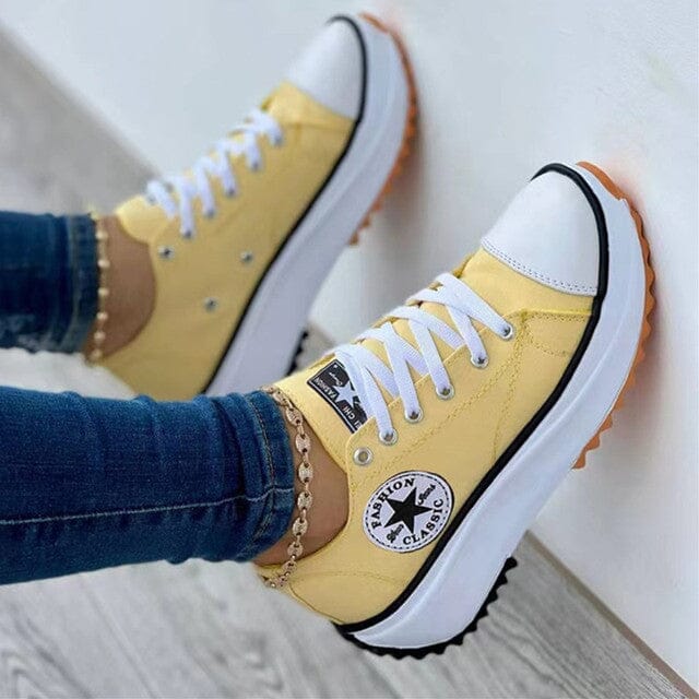 Women's white low-top canvas chunky sole sneakers with bold platform rubber outsole for everyday style