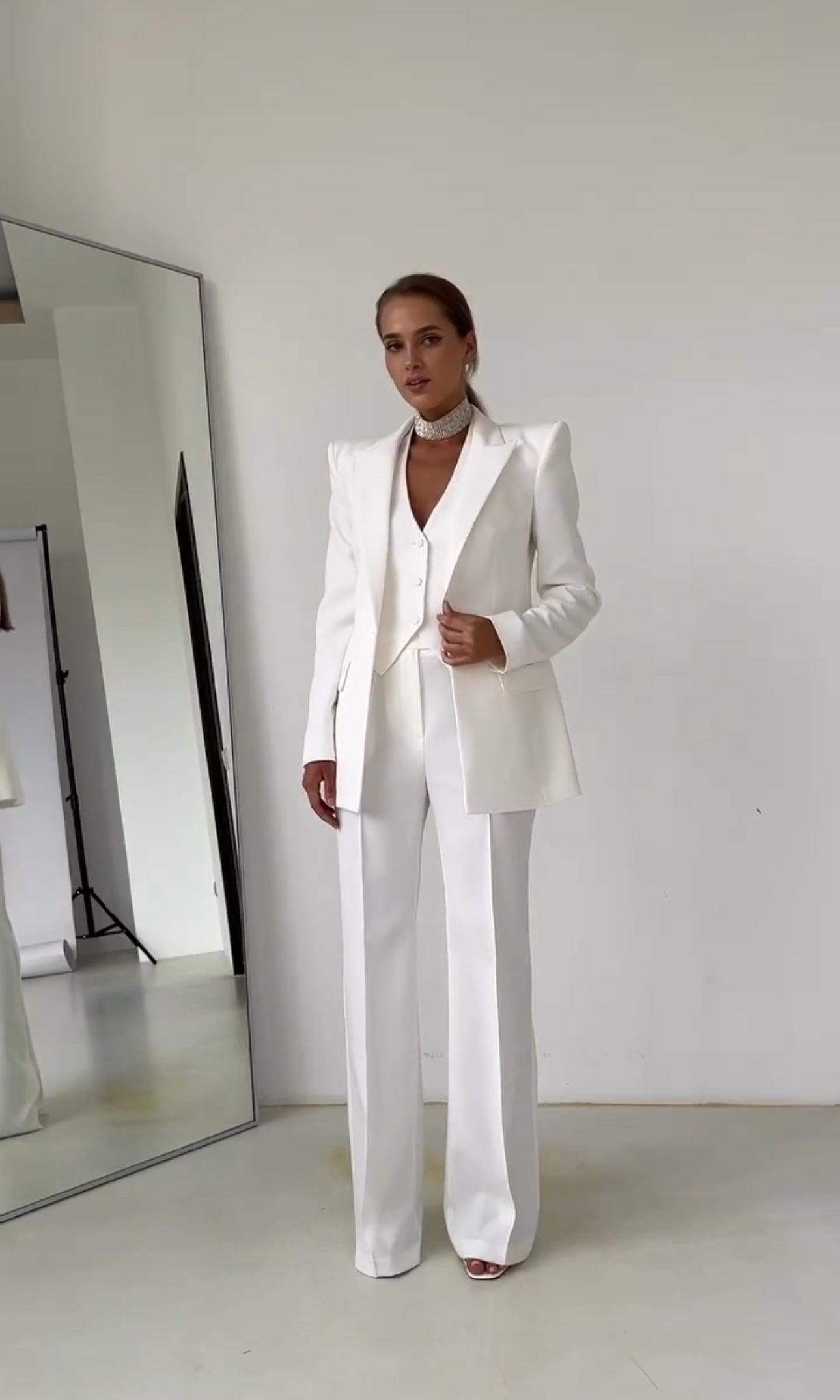 Women's emerald green 3-piece tailored suit set with blazer, waistcoat, and straight-leg trousers