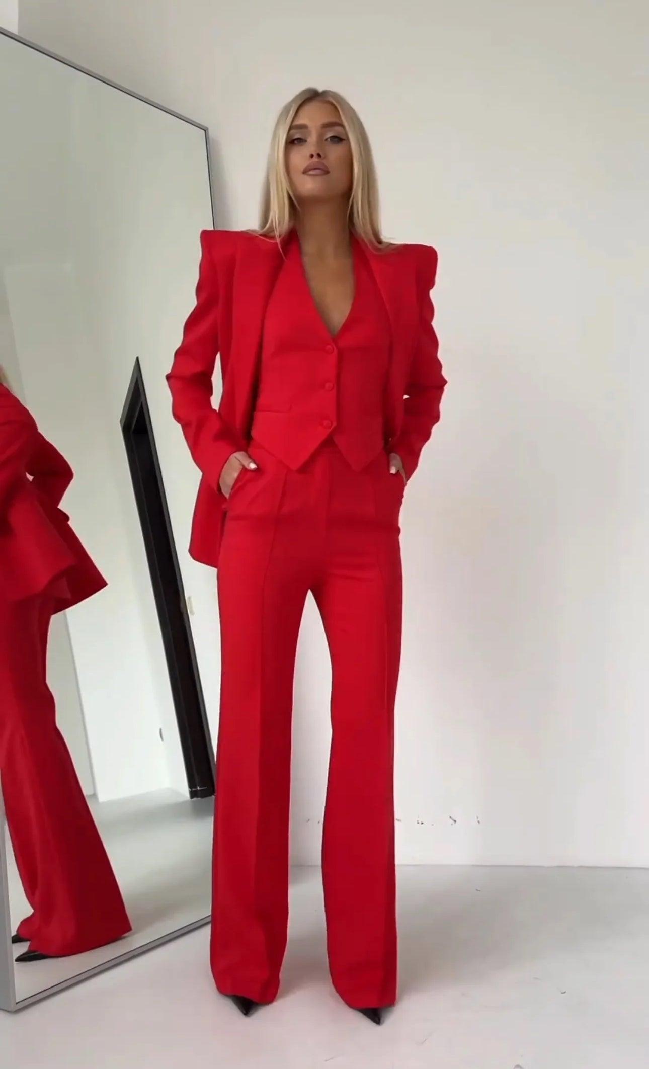 Women's tailored 3-piece emerald green suit set with blazer, waistcoat, and straight-leg trousers