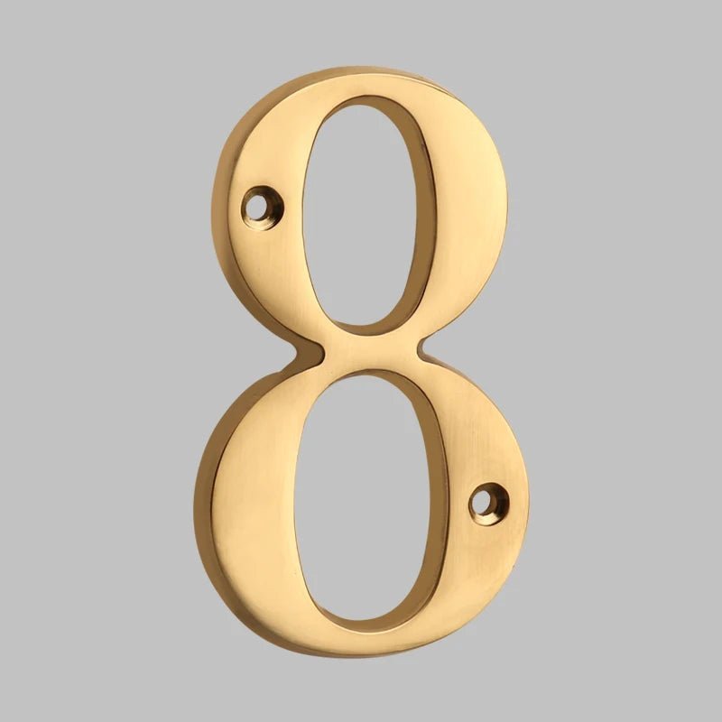 Solid brass oval house number sleek modern exterior address marker with timeless architectural design