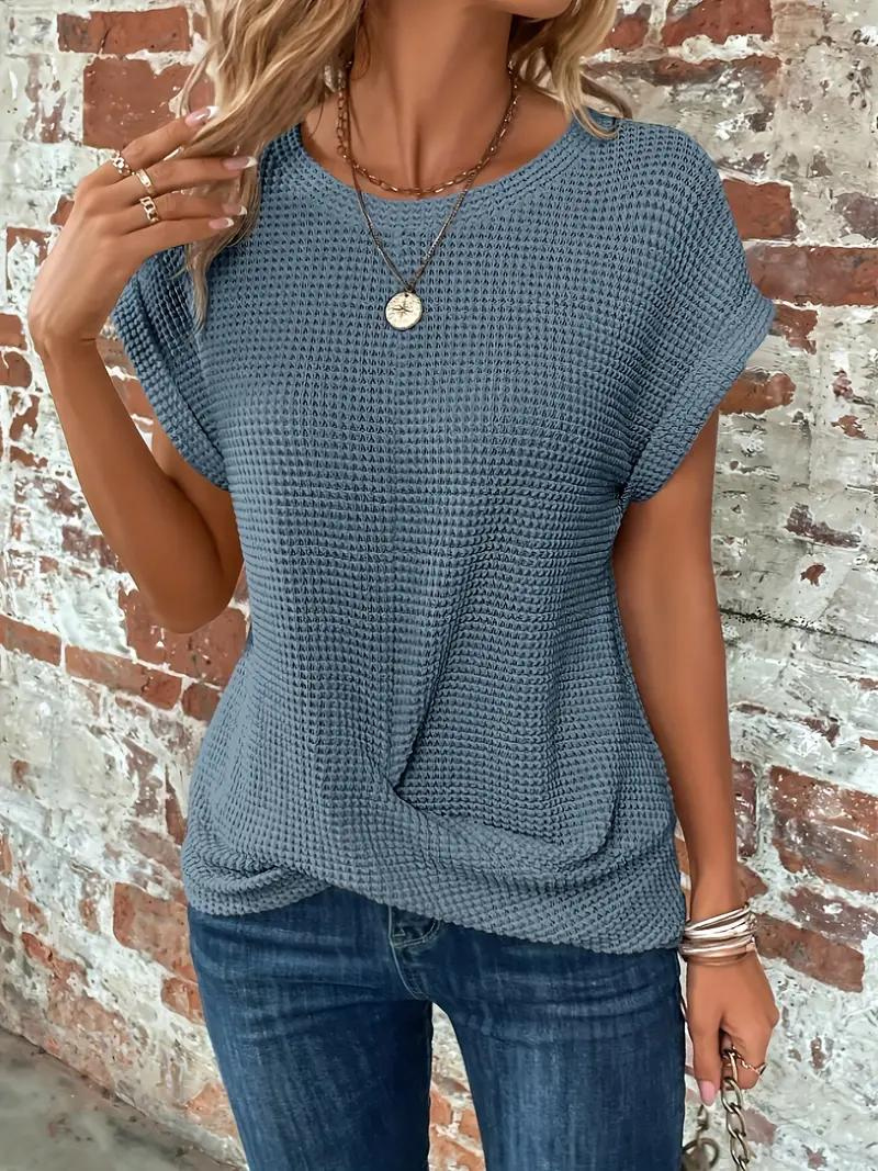 Women's white waffle knit relaxed tee with front twist hem detail for casual warm-weather style