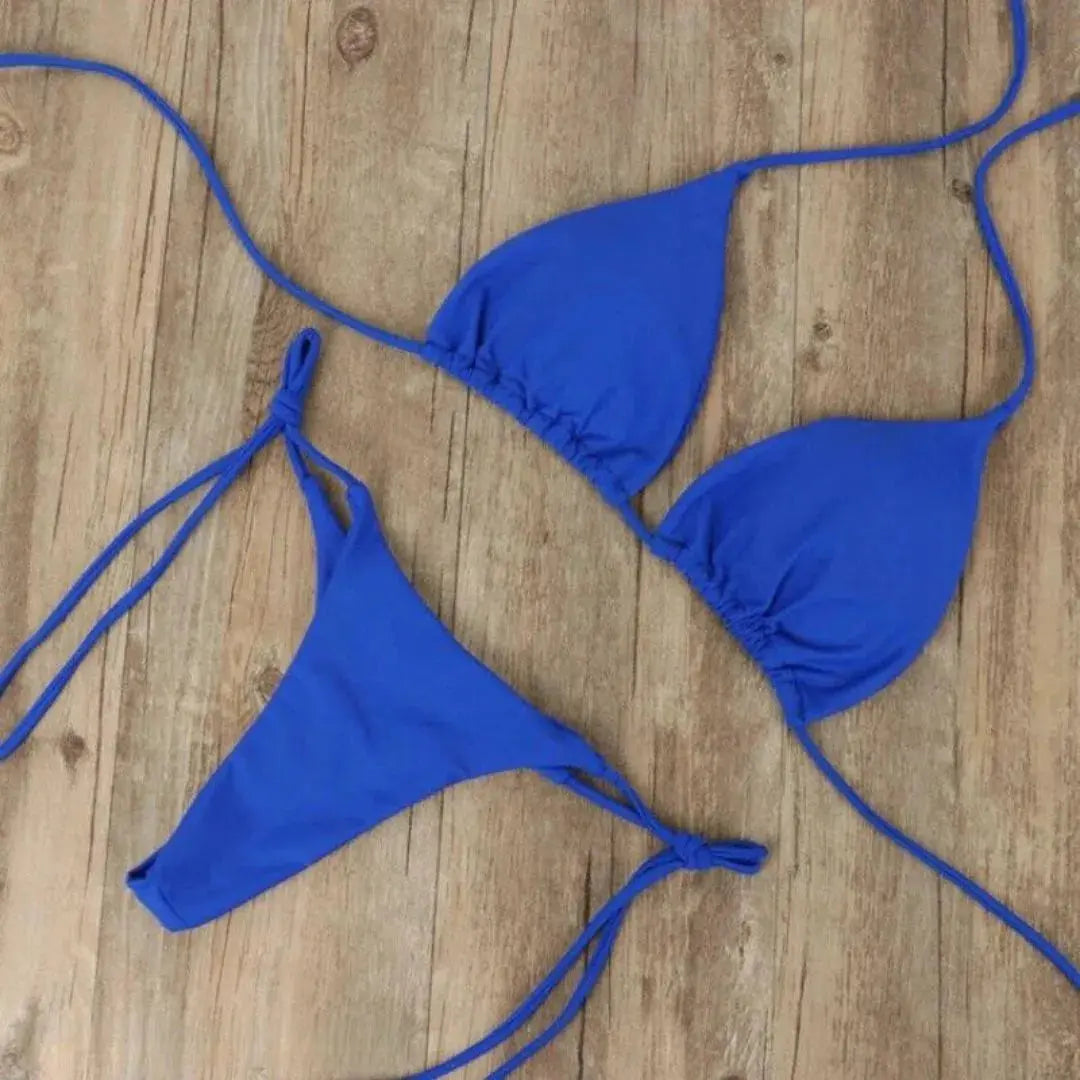 Women's classic triangle string bikini set in adjustable tie-side bottoms and halter top for beach