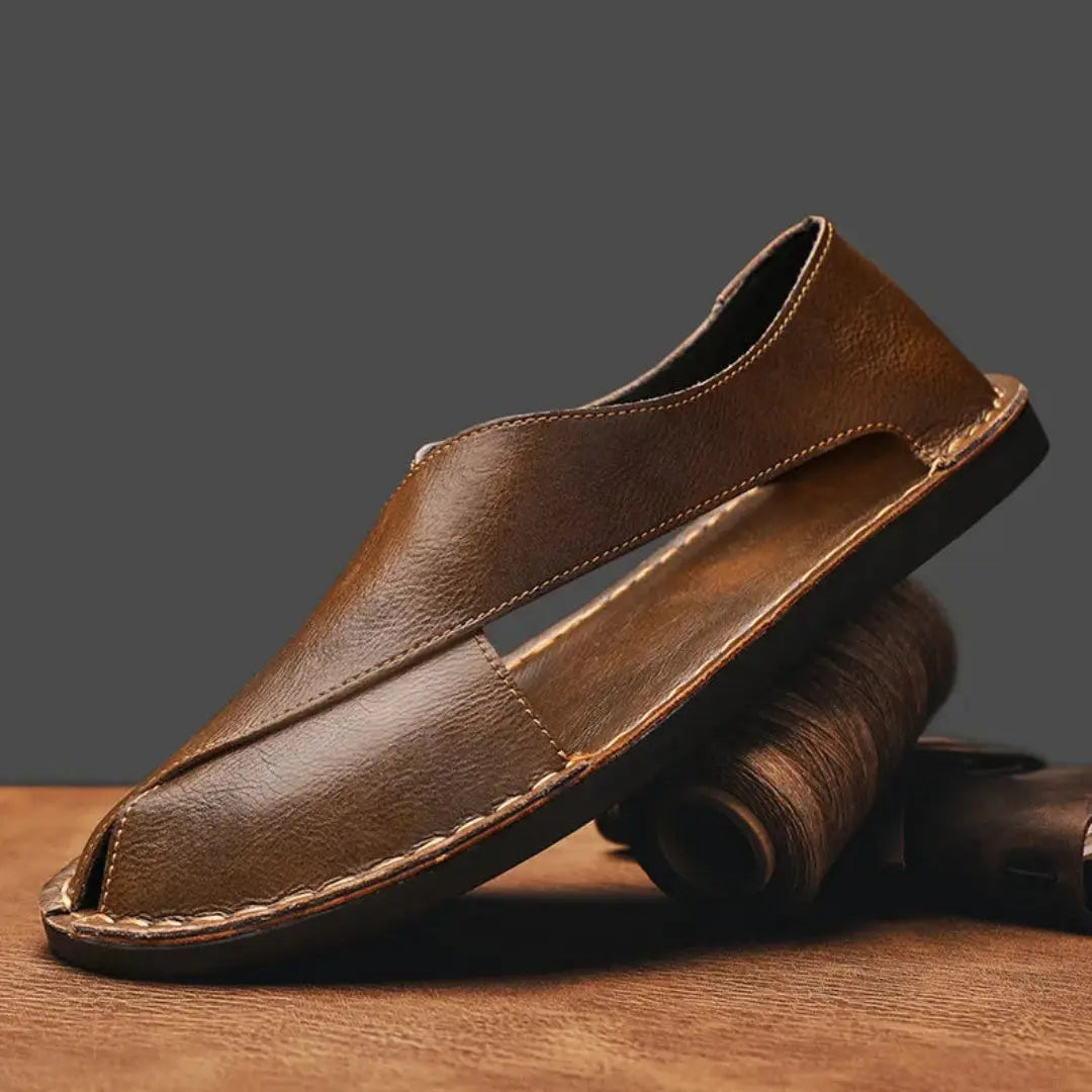 Men's brown handcrafted leather cross strap sandals with ergonomic footbed and slip-resistant sole