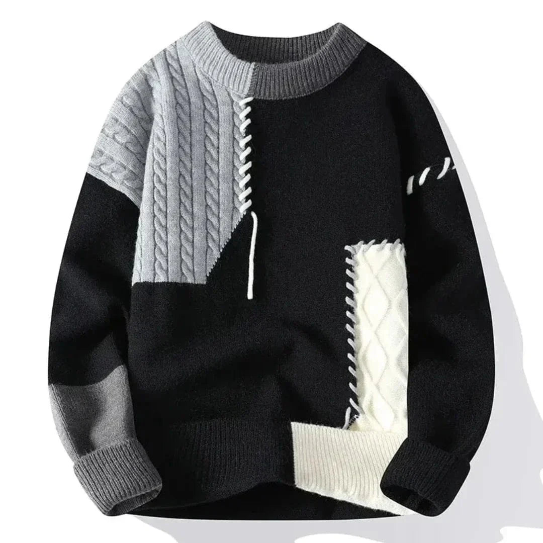 Men's patchwork knit pullover sweater with cable-knit textured panels and contrast stitching