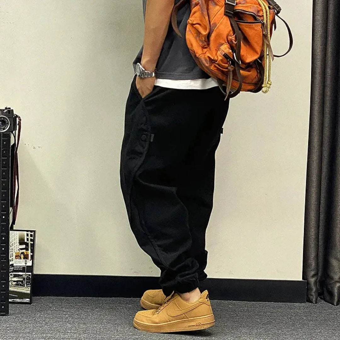 Men's olive oversized cargo jogger pants relaxed fit cuffed hems with functional utility pockets streetwear