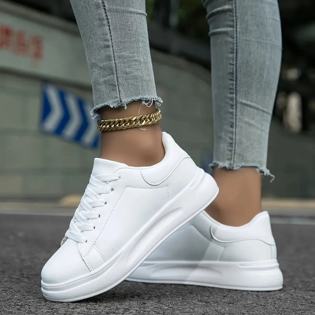 Ariana white low-top platform sneakers with elevated sole for urban streetwear style