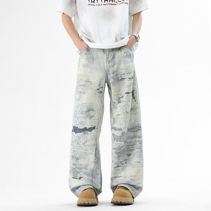 Blue denim wide-leg jeans bold all-over paint splatter print relaxed fit urban street style
