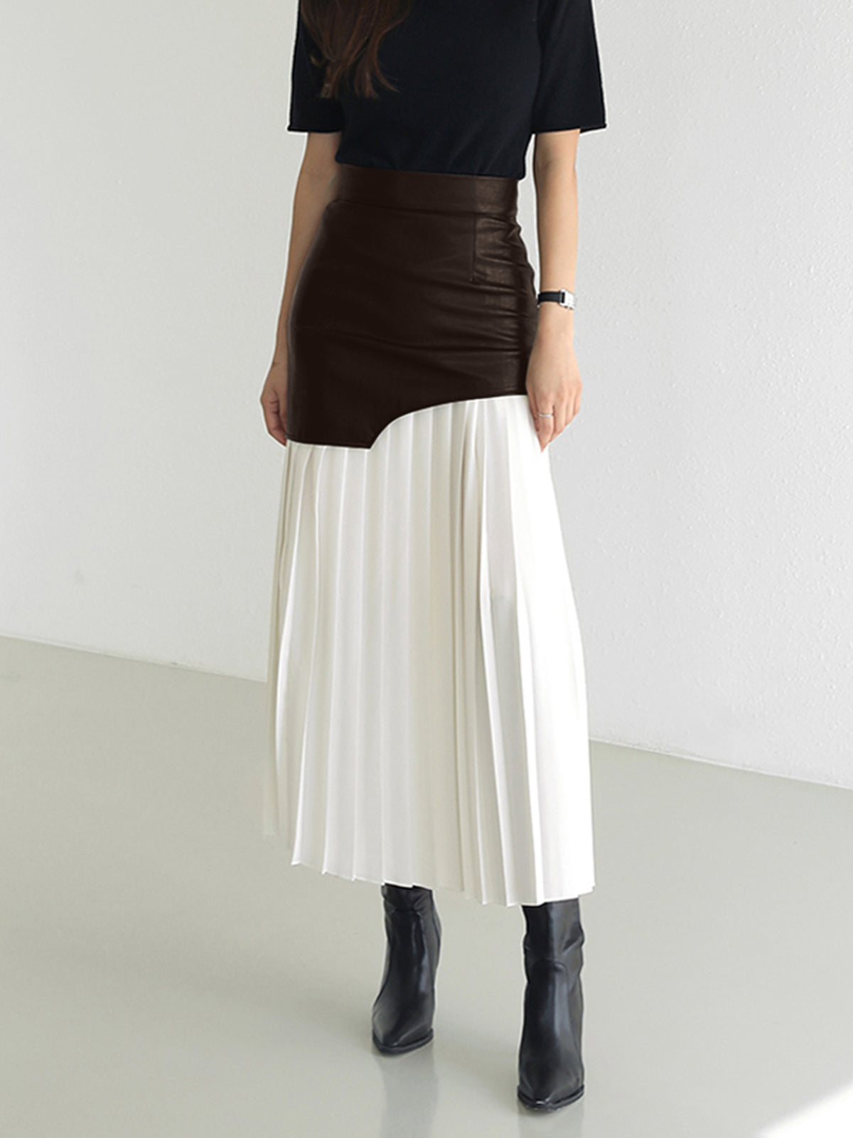 Black asymmetrical midi skirt faux leather chiffon blend dynamic silhouette urban elegant style