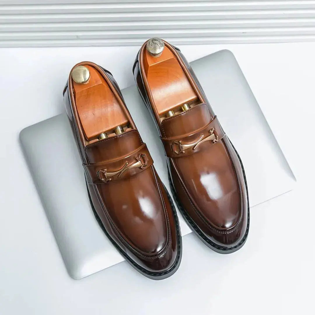 Black patent leather loafers with gold bit detailing, sleek dress style, non-slip comfort sole