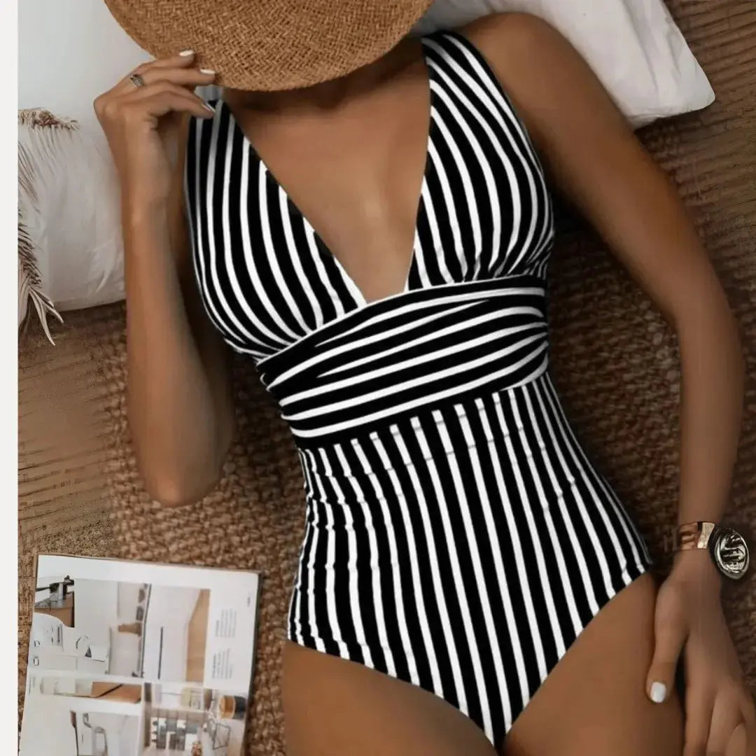 Women's striped deep V halter one-piece swimsuit with slimming vertical stripes and flattering beach silhouette