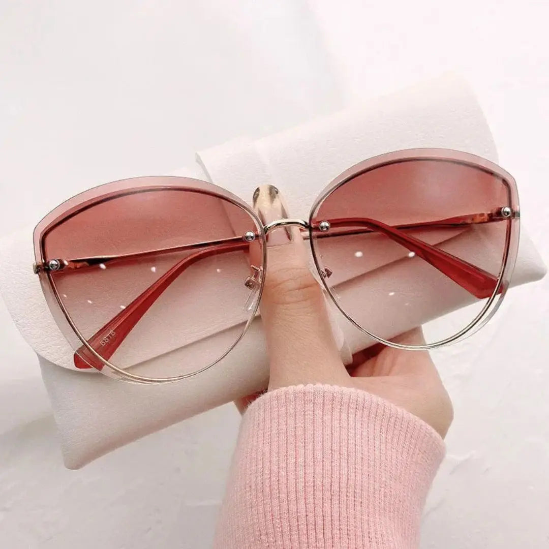 Aurora rimless cat-eye sunglasses women gold-tone accents UV400 protection fashion-forward elegant silhouette