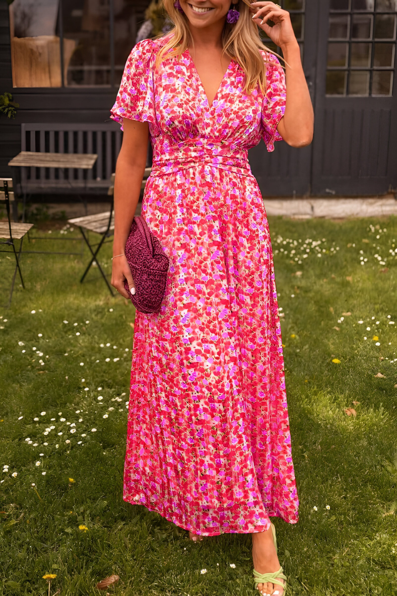 Floral maxi dress with flutter sleeves, V-neck, cinched waist in vibrant summer night print