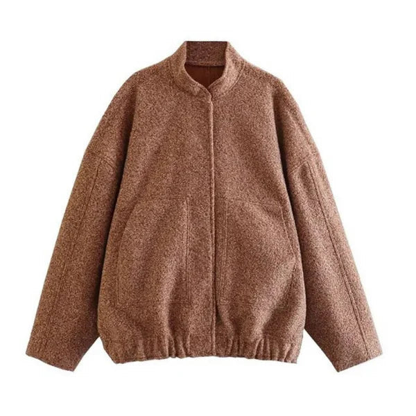 Women's oversized bomber jacket in neutral tones, relaxed weather-resistant silhouette with ribbed cuffs
