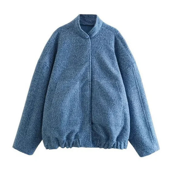 Women's oversized bomber jacket in neutral tones, relaxed weather-resistant silhouette with ribbed cuffs