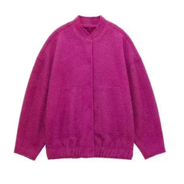 Women's oversized bomber jacket in neutral tones, relaxed weather-resistant silhouette with ribbed cuffs