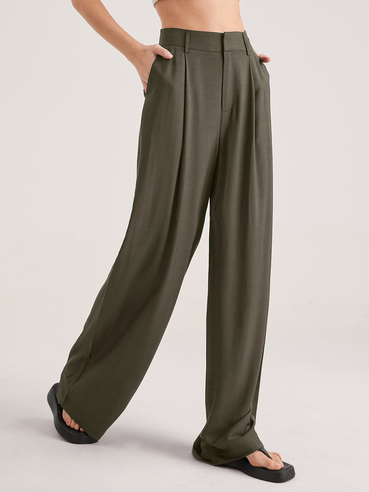 Women's high waisted wide leg trousers with subtle pleat detailing, tailored silhouette, all-day comfort fit