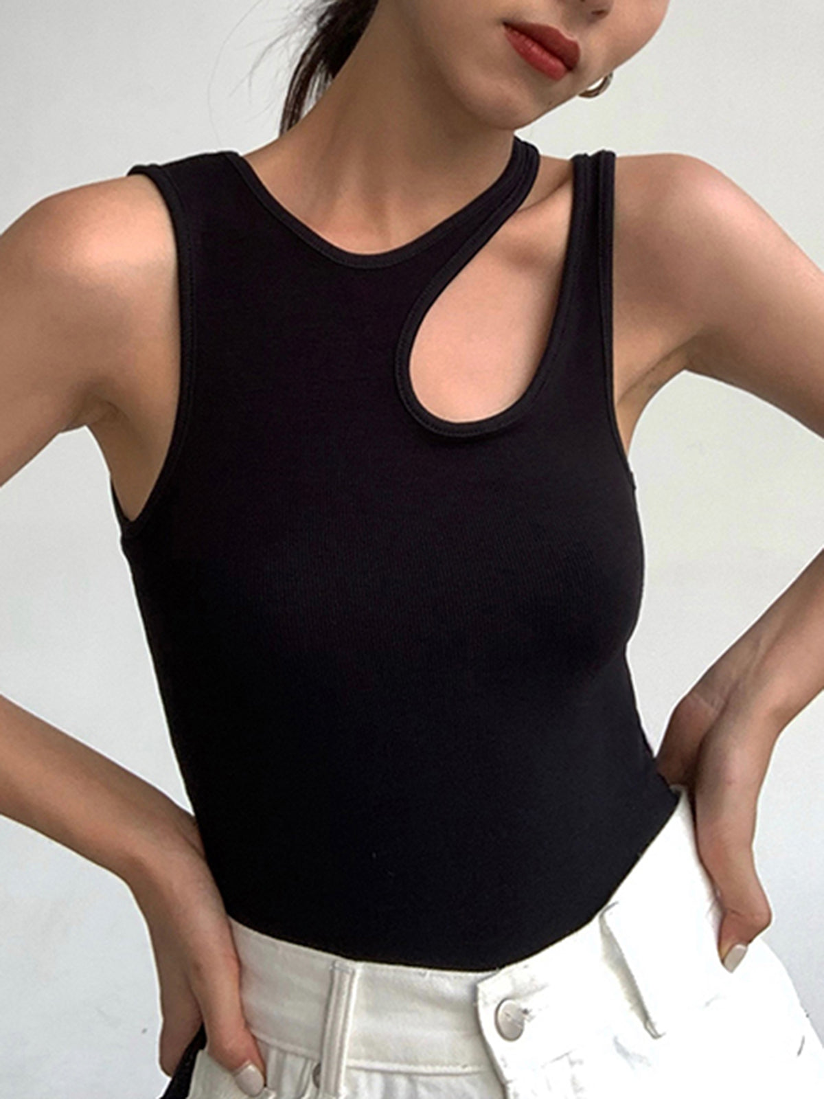 Women's ribbed tank top with asymmetric neckline and bold front cutout, minimalist style
