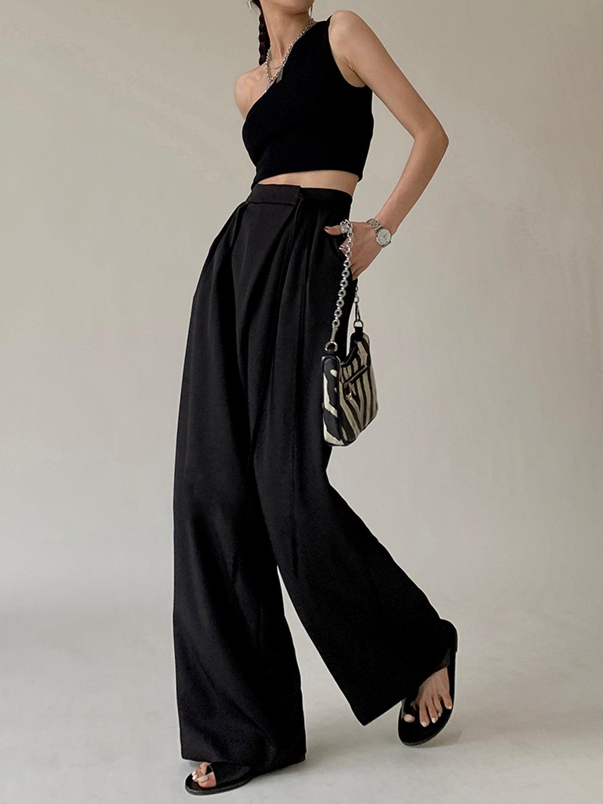 Women's flowy wide leg pants with tie waist in neutral tones, casual elegant leisurewear silhouette