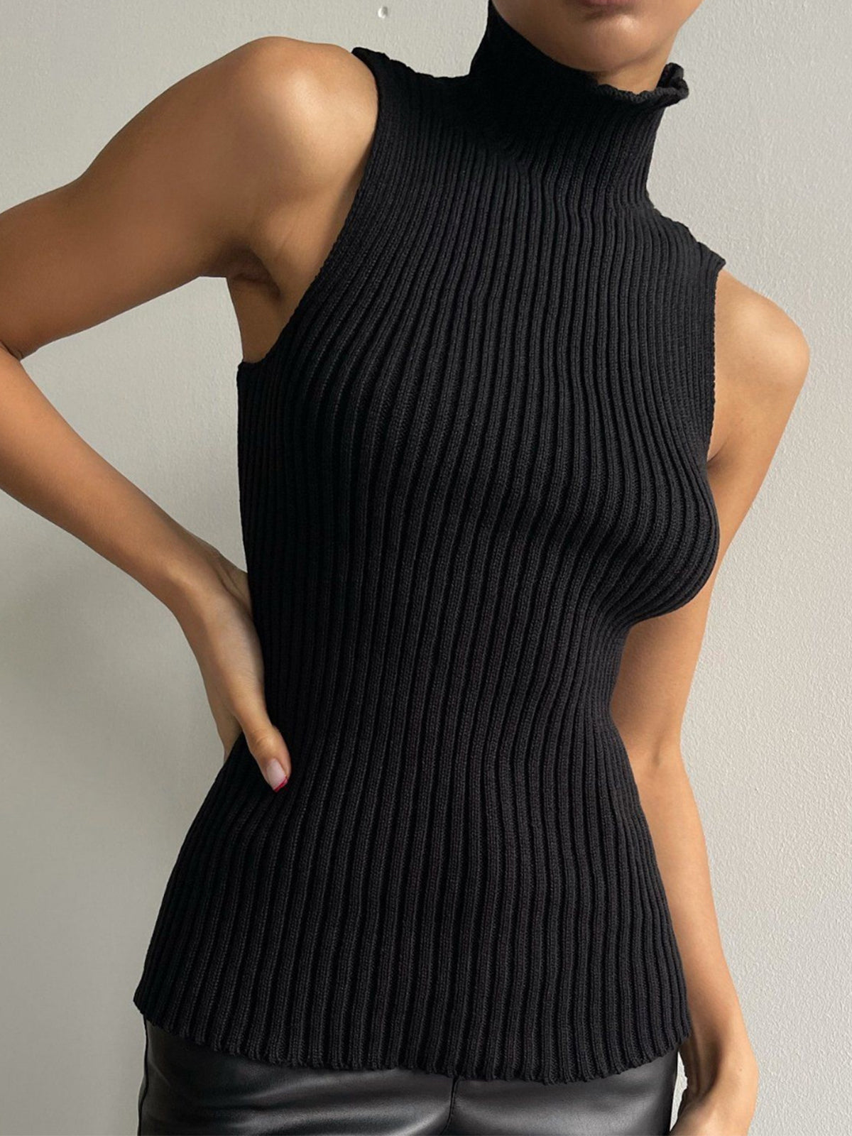 Women's ribbed sleeveless knit top in neutral tone, mock neck, slim layering essential