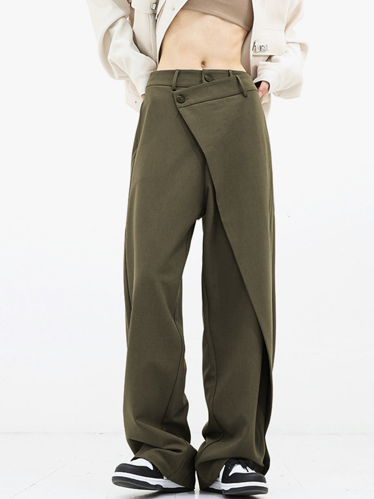 Black asymmetrical relaxed fit pants with draped overlay and dual button closure