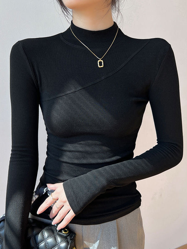 Women's fitted ribbed mock neck long sleeve top with diagonal seaming in a stretchy knit