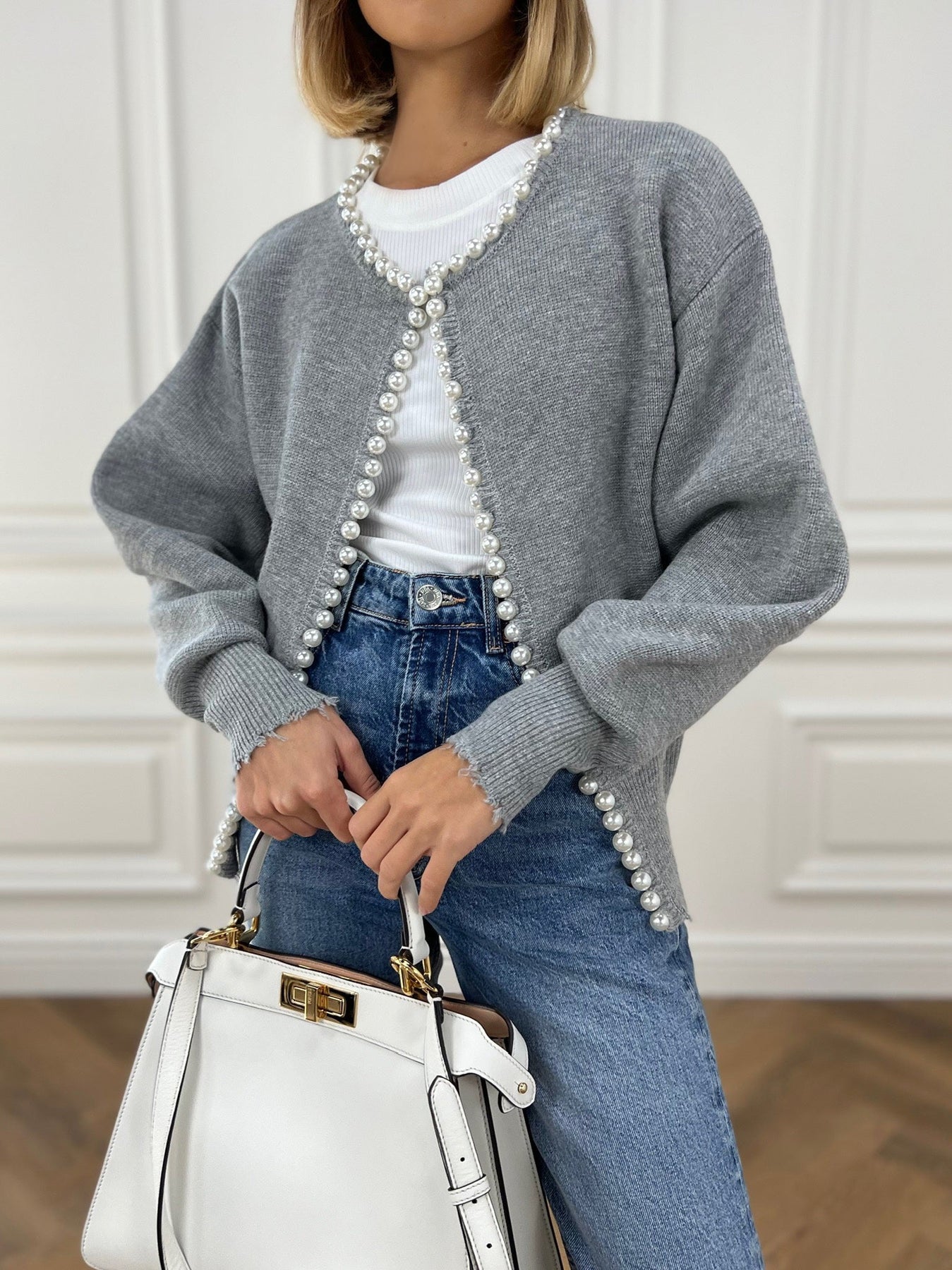Women's soft knit cardigan with pearl trim detailing, round neckline, polished versatile layering piece