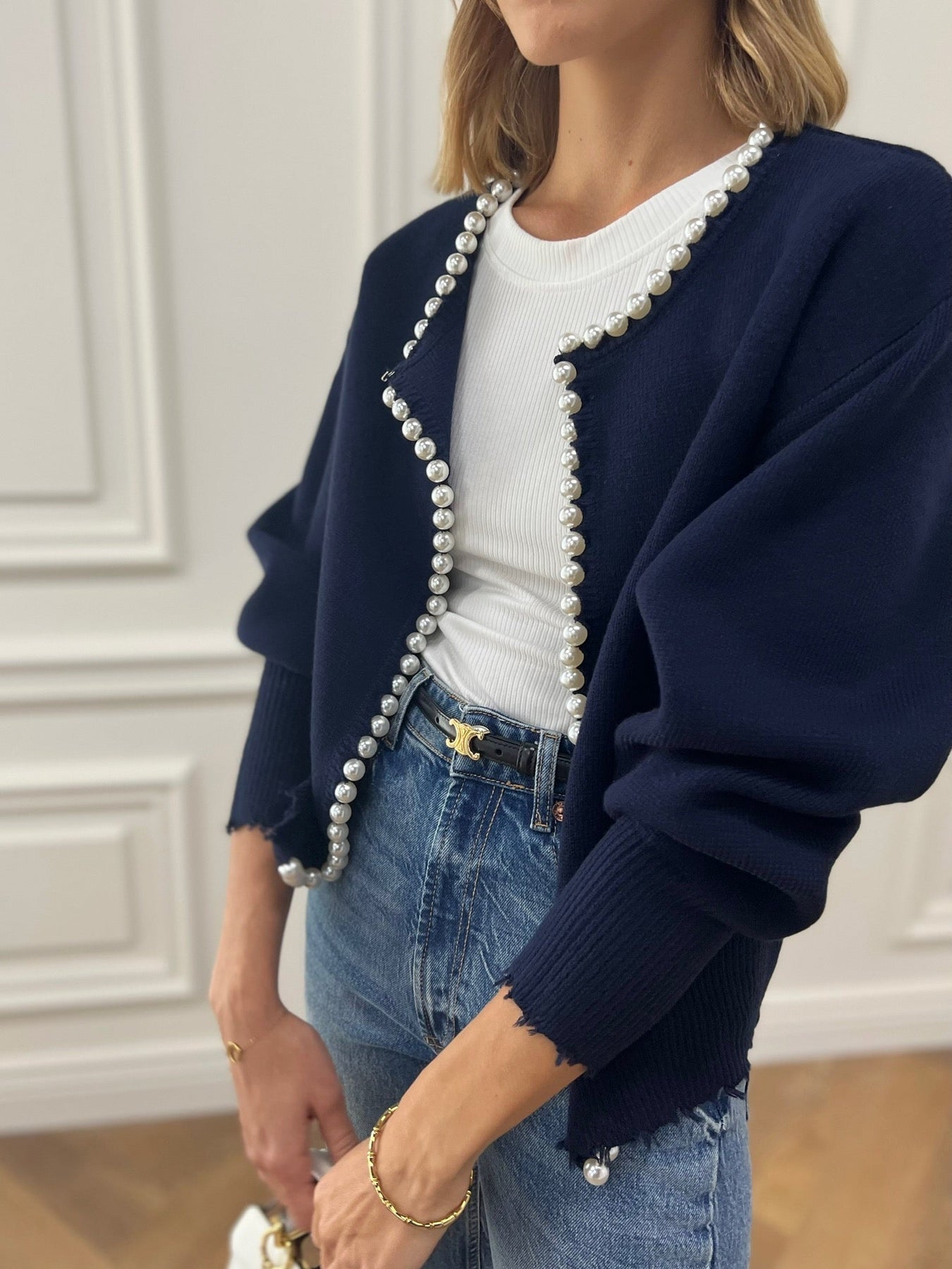 Women's soft knit cardigan with pearl trim detailing, classic round neckline, elegant versatile layering piece