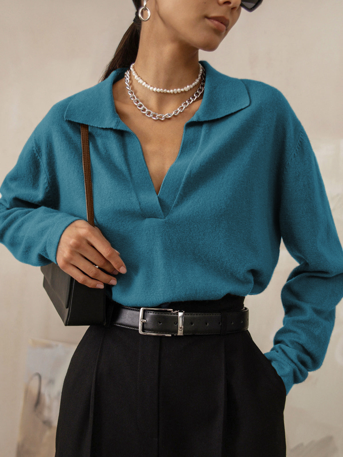 Women's soft knit V-neck sweater in neutral tone, flattering neckline, versatile casual to elegant style