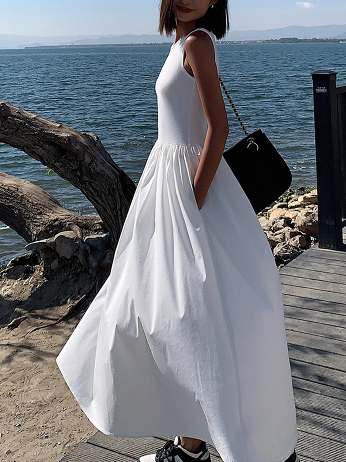 Elegant sleeveless cotton blend maxi dress with fitted bodice and full gathered skirt for formal wear