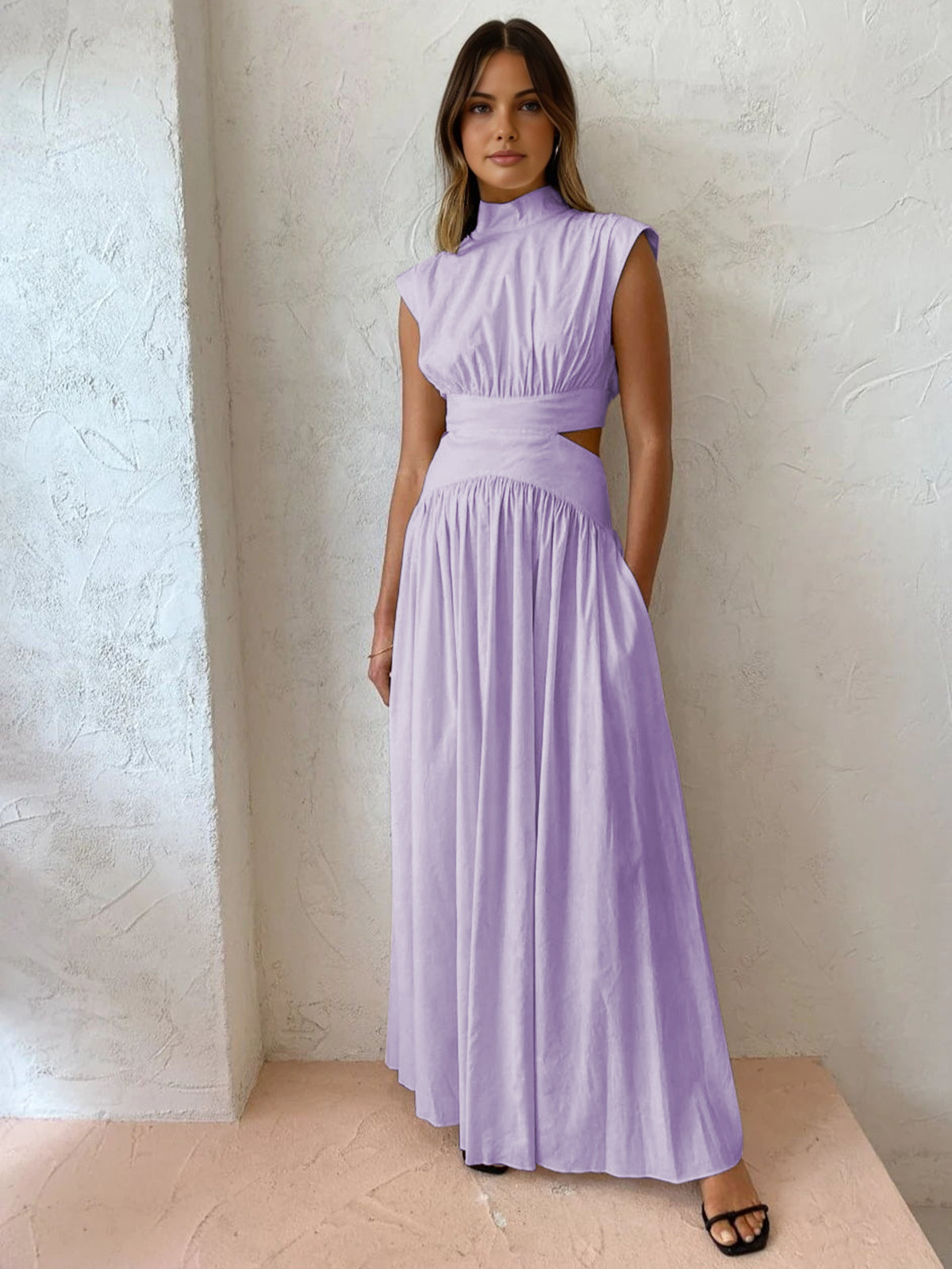 Black sleeveless formal maxi dress high mock neck elegant cut-outs fluid silhouette modern women