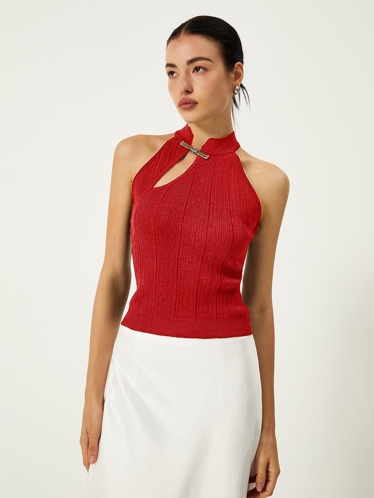 Asymmetrical cream knit viscose sweater vest with cutout detail and button closure for elegant style