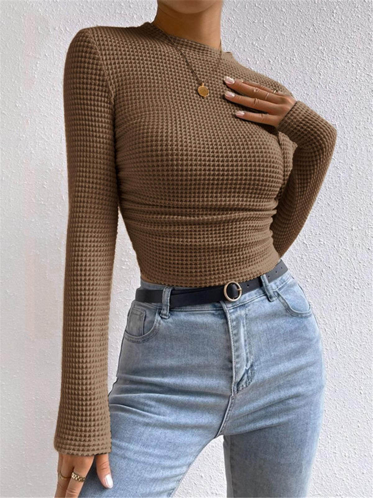 Women's beige waffle knit cropped long sleeve top with contoured silhouette for casual wear