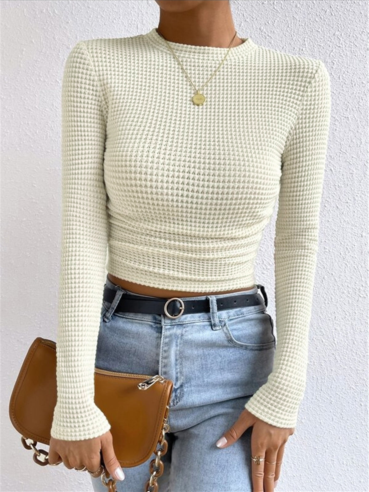 Women's beige waffle knit cropped long sleeve top with contoured silhouette for casual wear