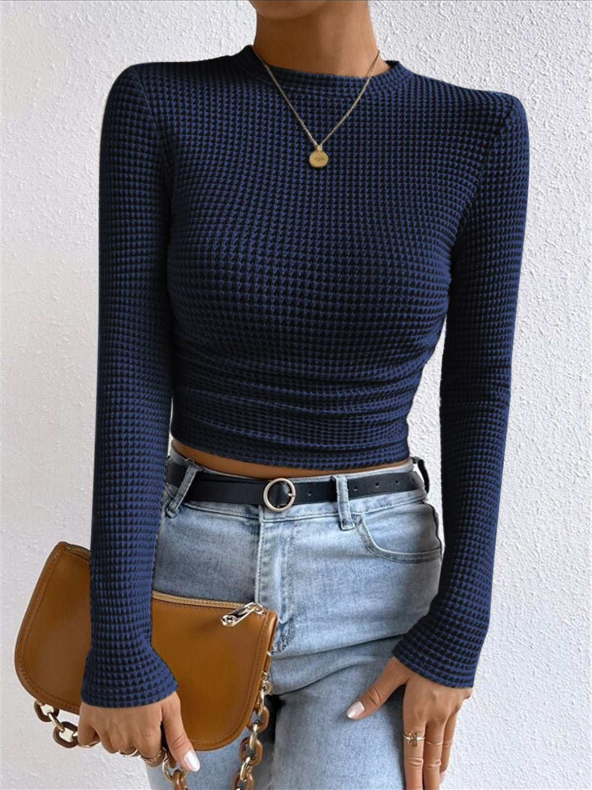 Women's waffle knit cropped long sleeve top with contoured silhouette in soft textured fabric