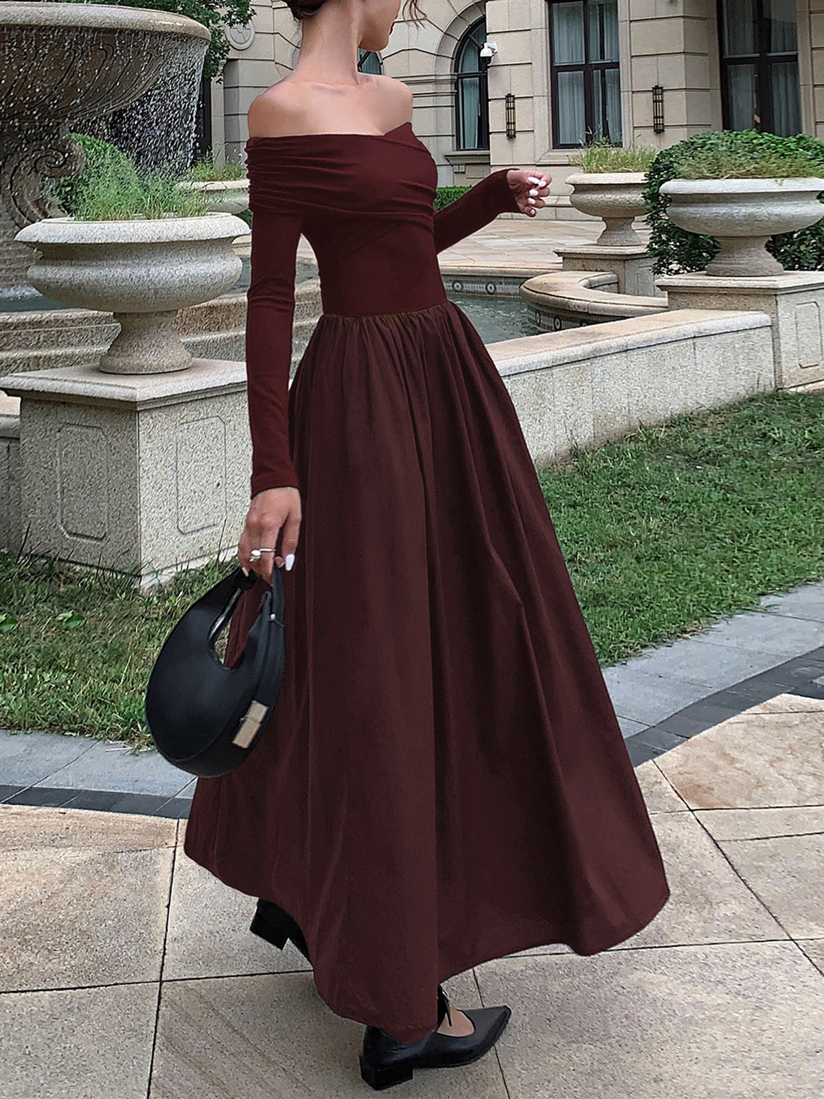 Elegant black off-shoulder criss-cross long dress with open shoulder detailing for evening wear