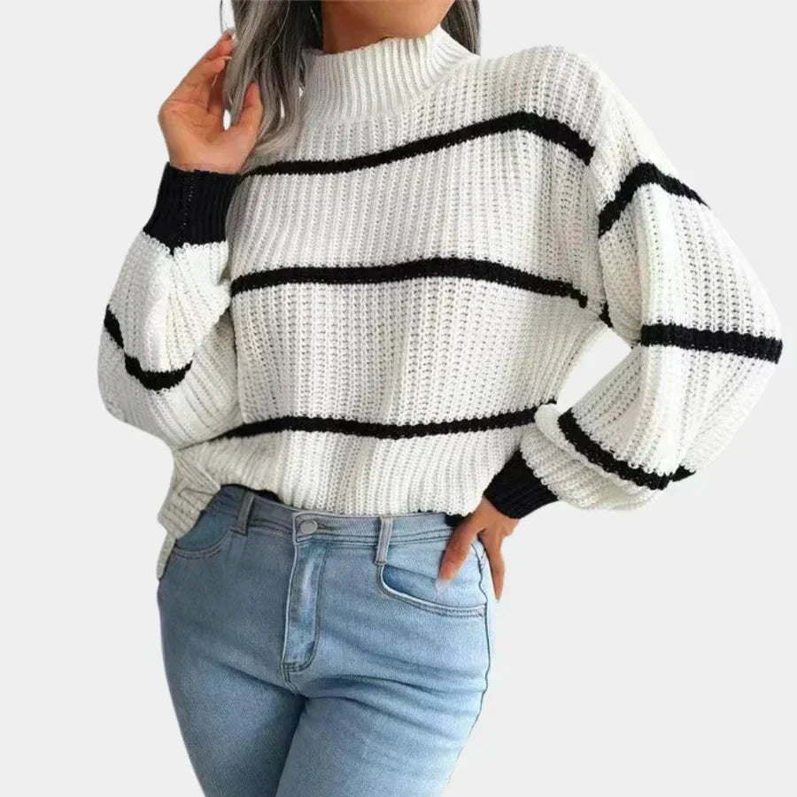 Women's elegant ivory wool sweater with sleek minimalist cut and refined timeless silhouette for modern style