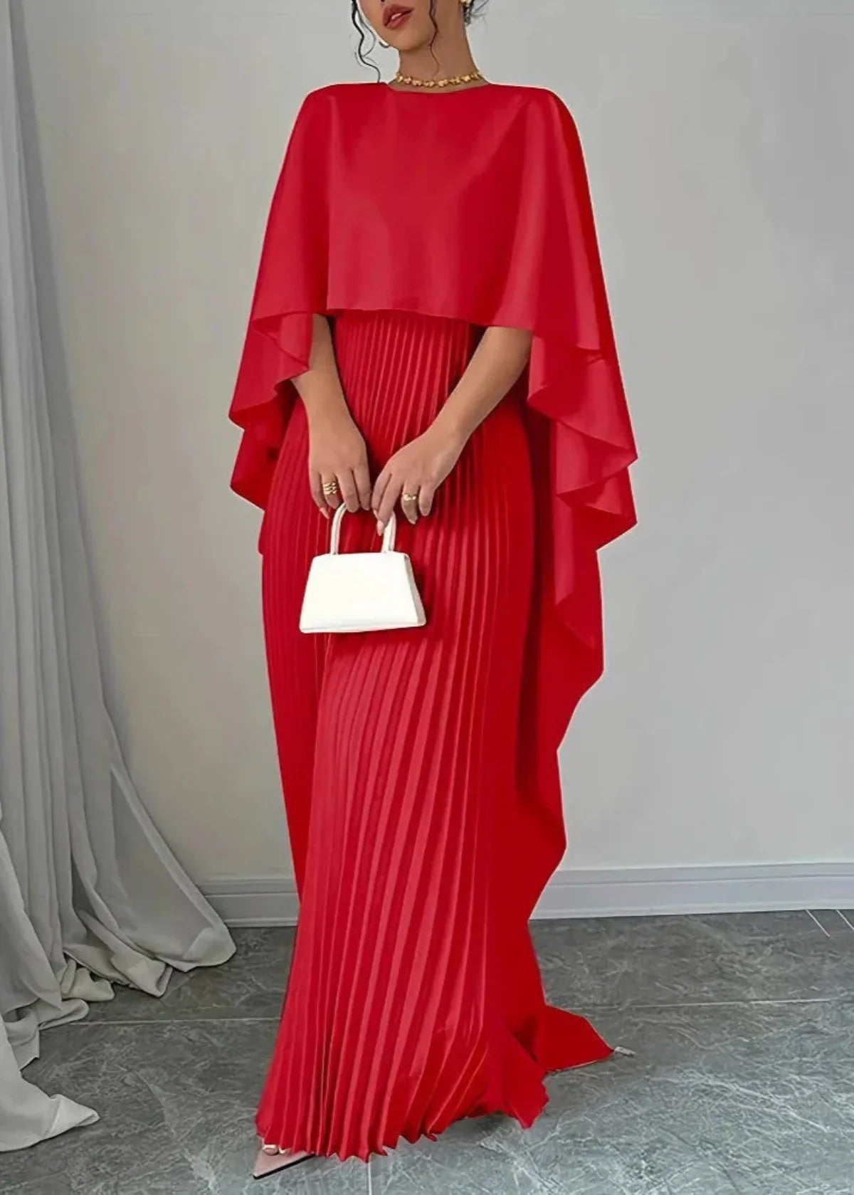 Women's black pleated cape overlay maxi dress with flowing skirt for elegant evening wear