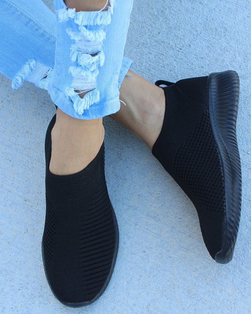 Women's white slip-on walking sneakers with stretch elastic upper and lightweight air-cushion sole