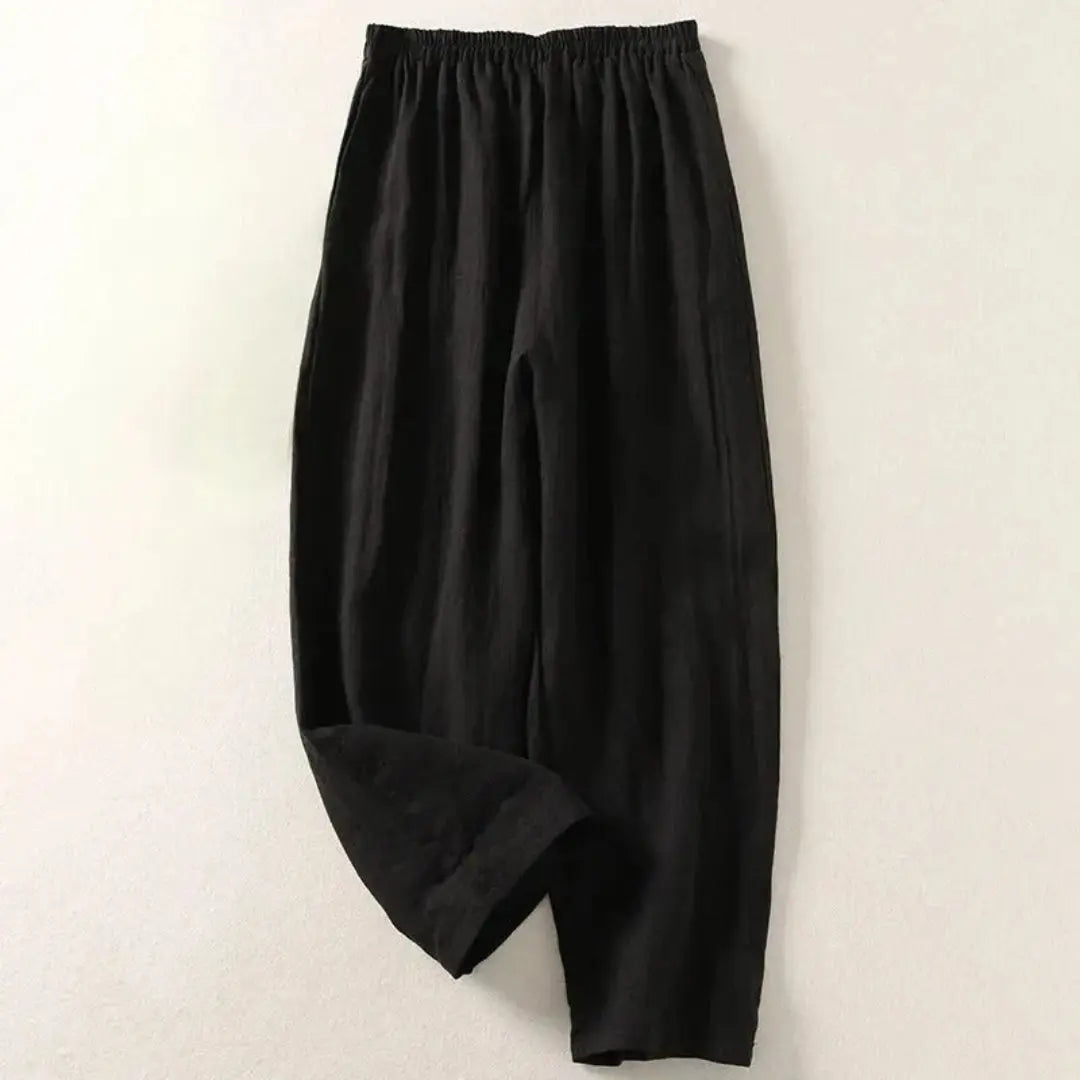 Women's lightweight linen pants in natural tones, relaxed wide-leg cut with elastic waistband